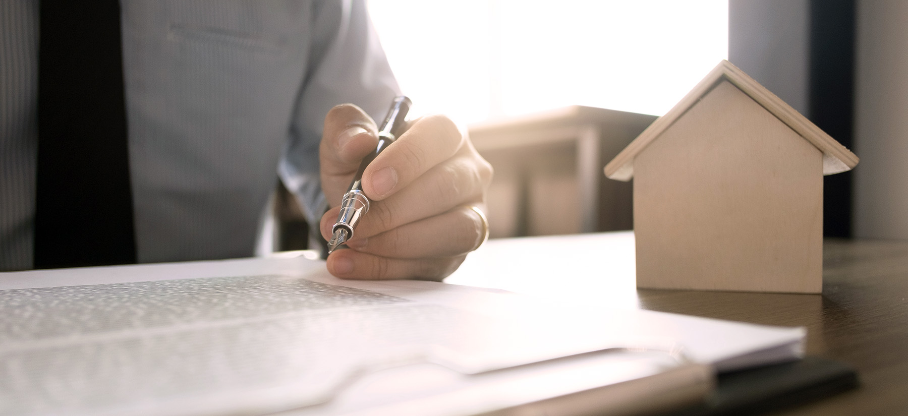 close up of real estate agent calculating sale report