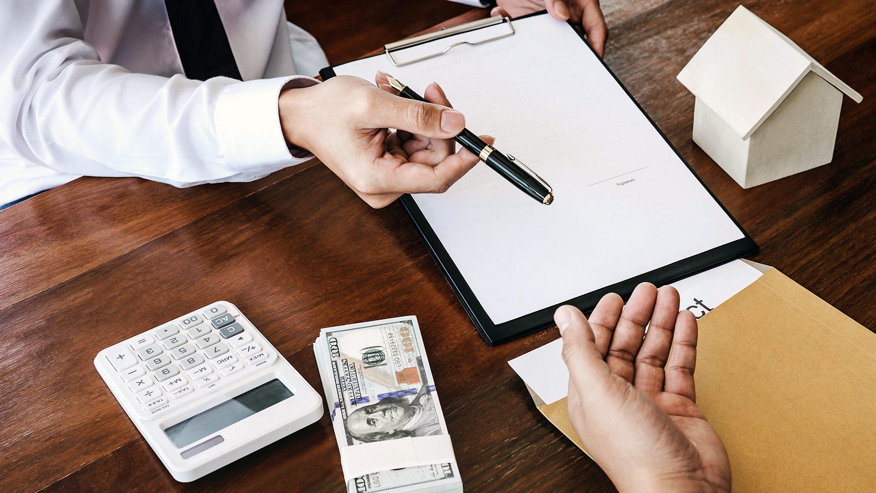Business Signing a Contract Buy - sell house, Man sign a home in
