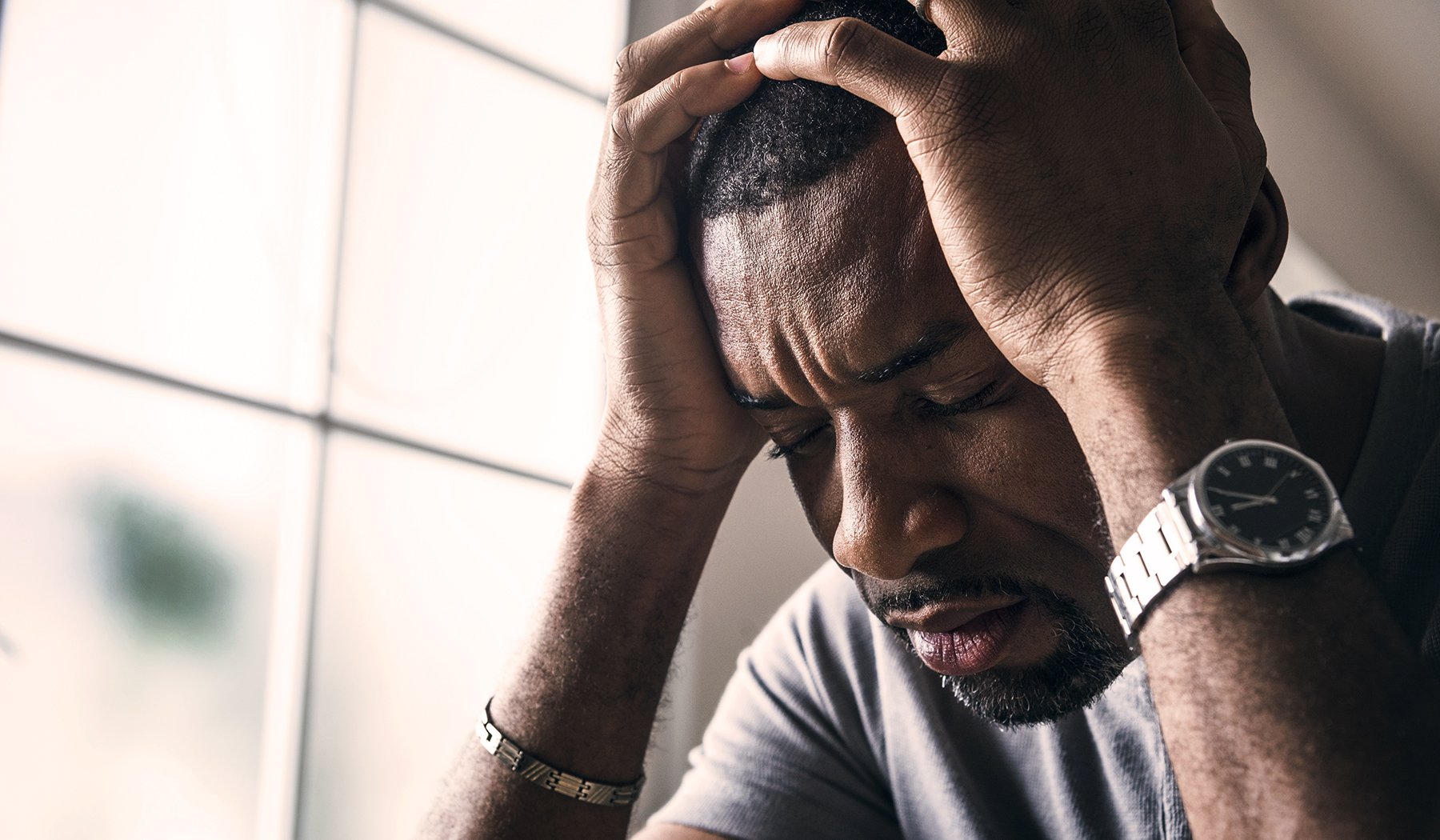 Black guy stressting and headache