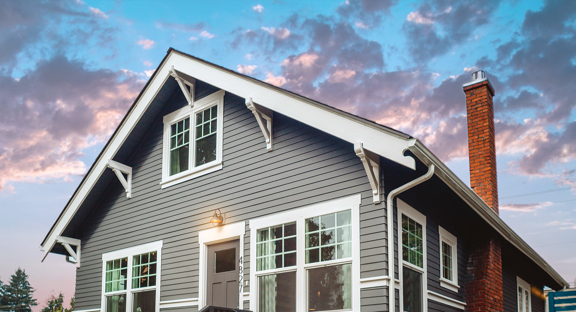 gray-house-under-blue-and-gray-sky-1569003