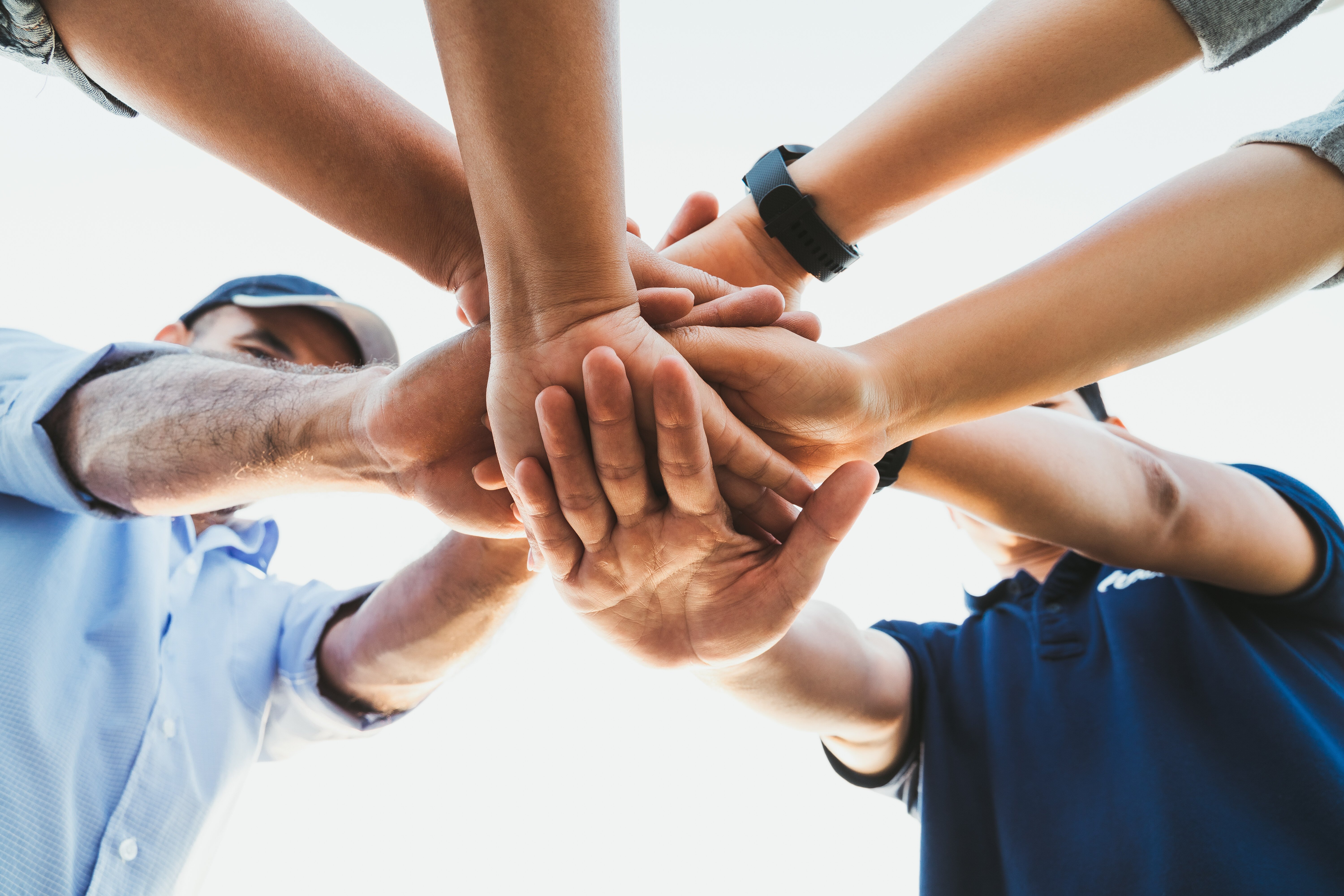 People putting their hands together. Friends with stack of hands