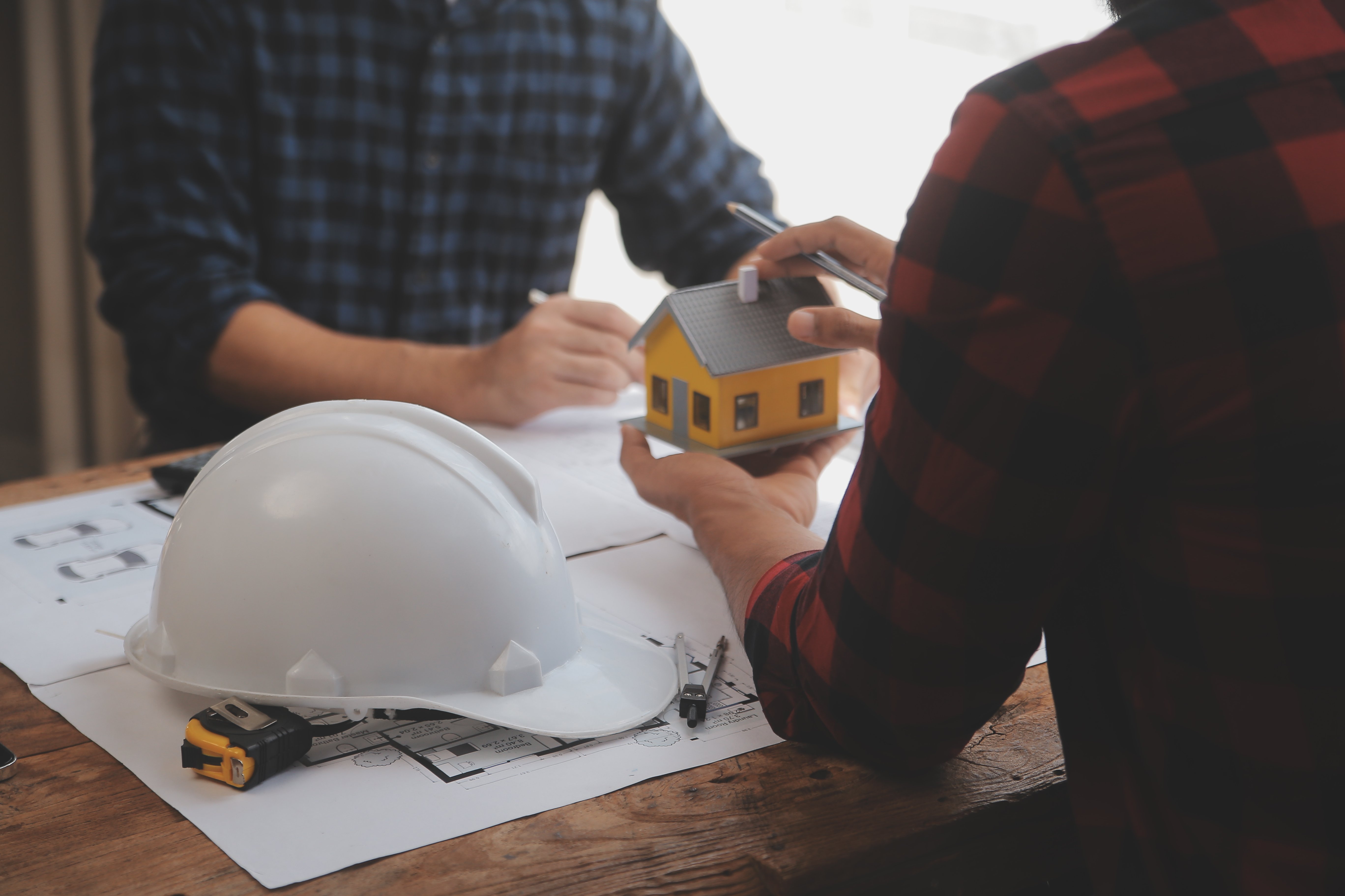 Close up of civil male engineer asian working on blueprint archi