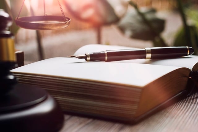 vecteezy_business-and-lawyers-discussing-contract-papers-with-brass_11309936