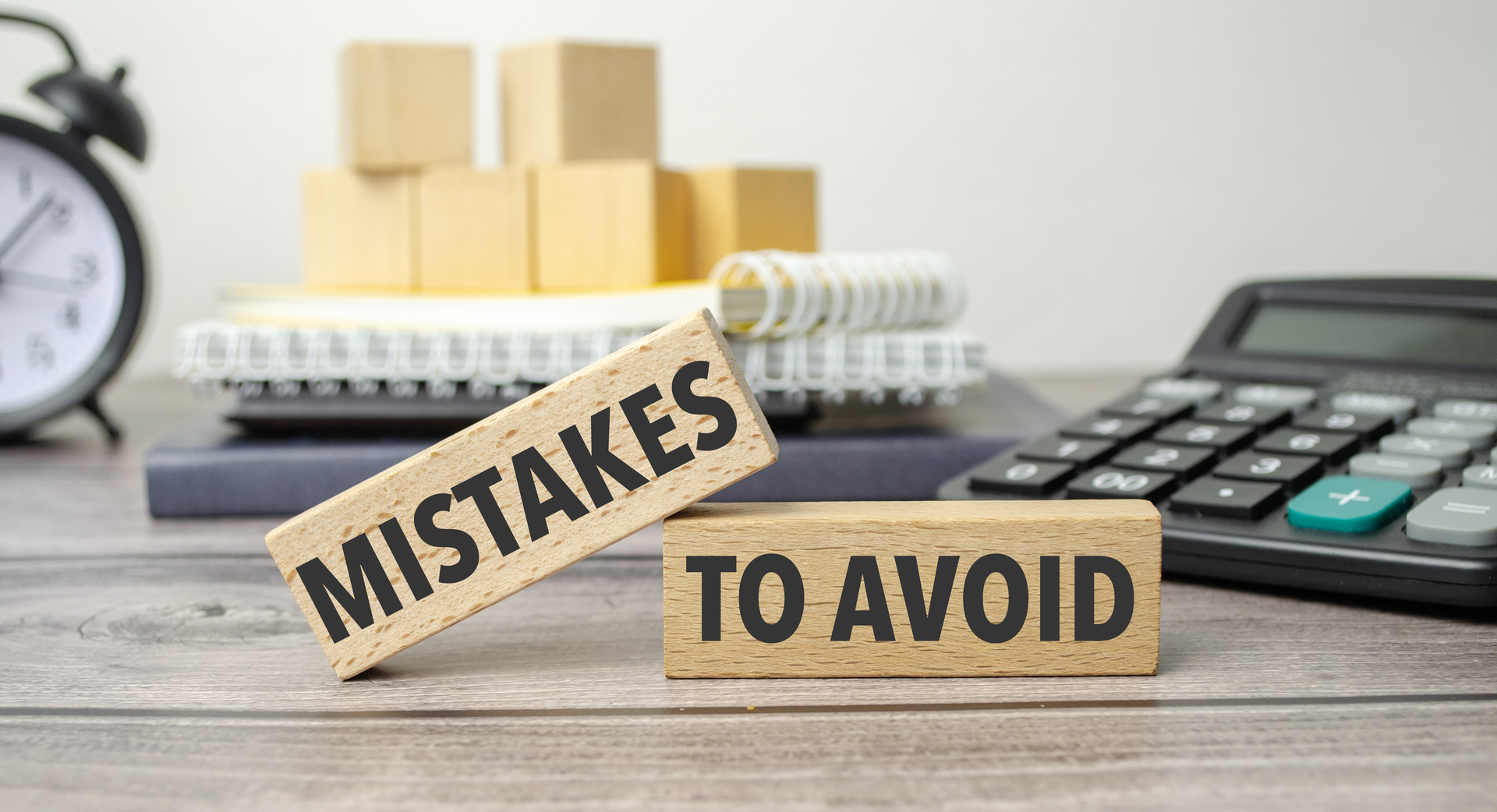 Mistakes To Avoid on the work table and alarm clock