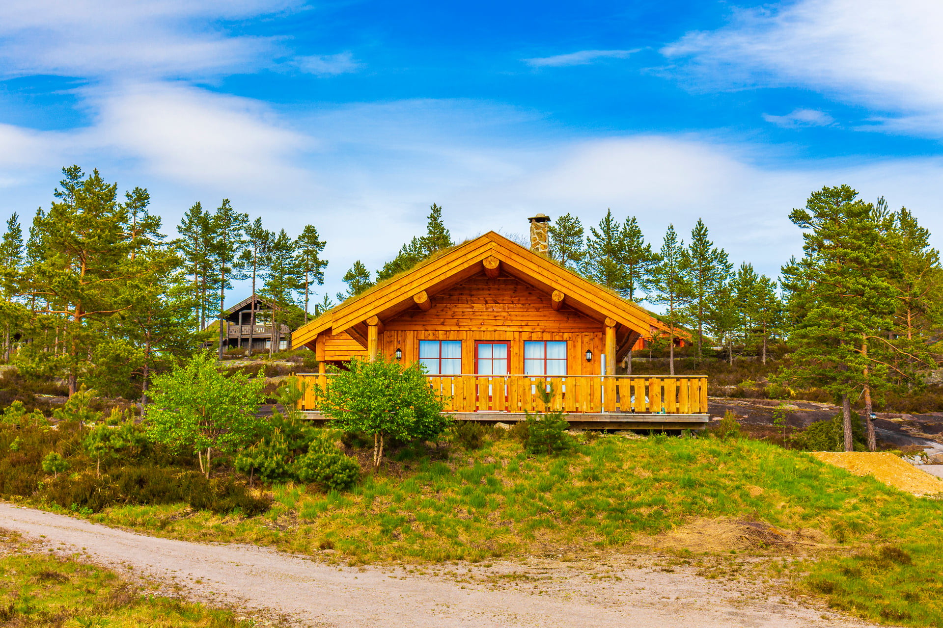 Norwegian wooden cabins cottages in the nature landscape Nissedal Norway.