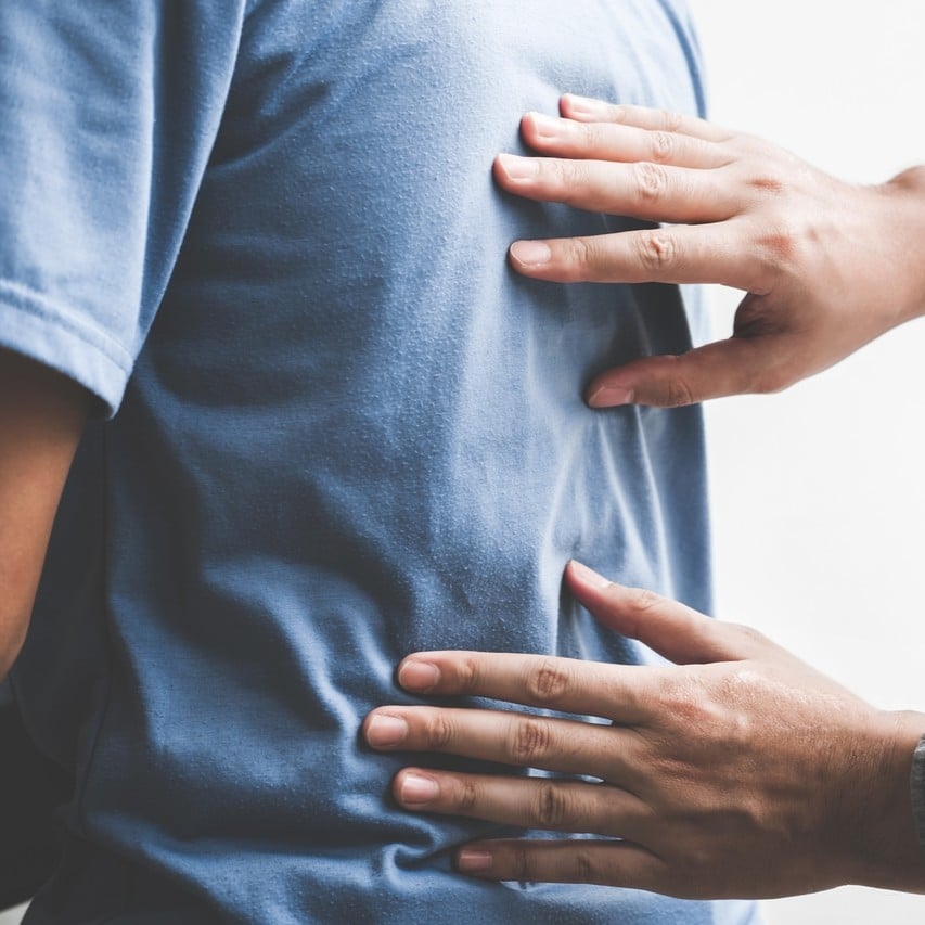 Doctor checking patient with spine to determine the cause of illness