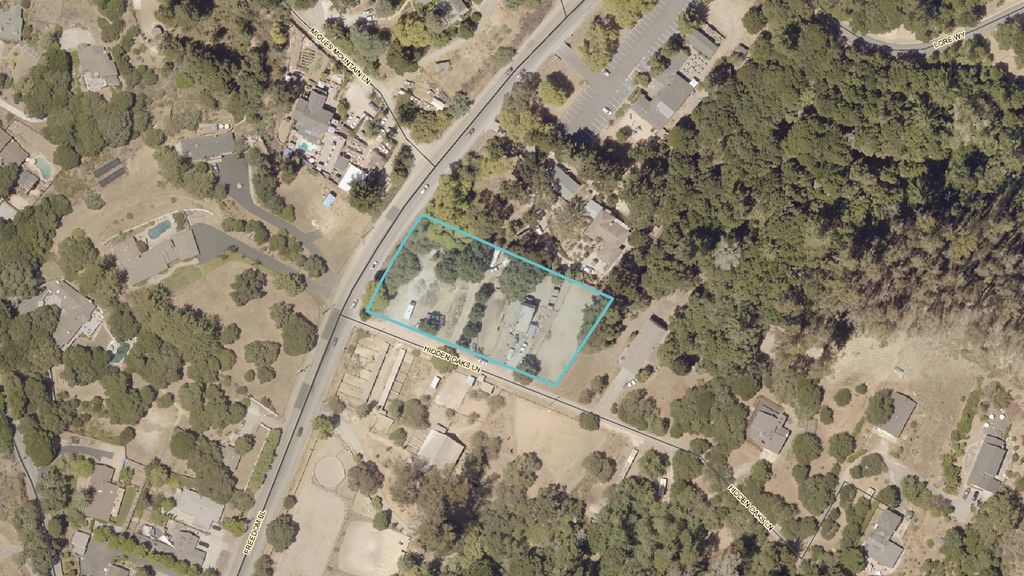 Aerial view of the 1.2-acre parcel outlined among oak woodland