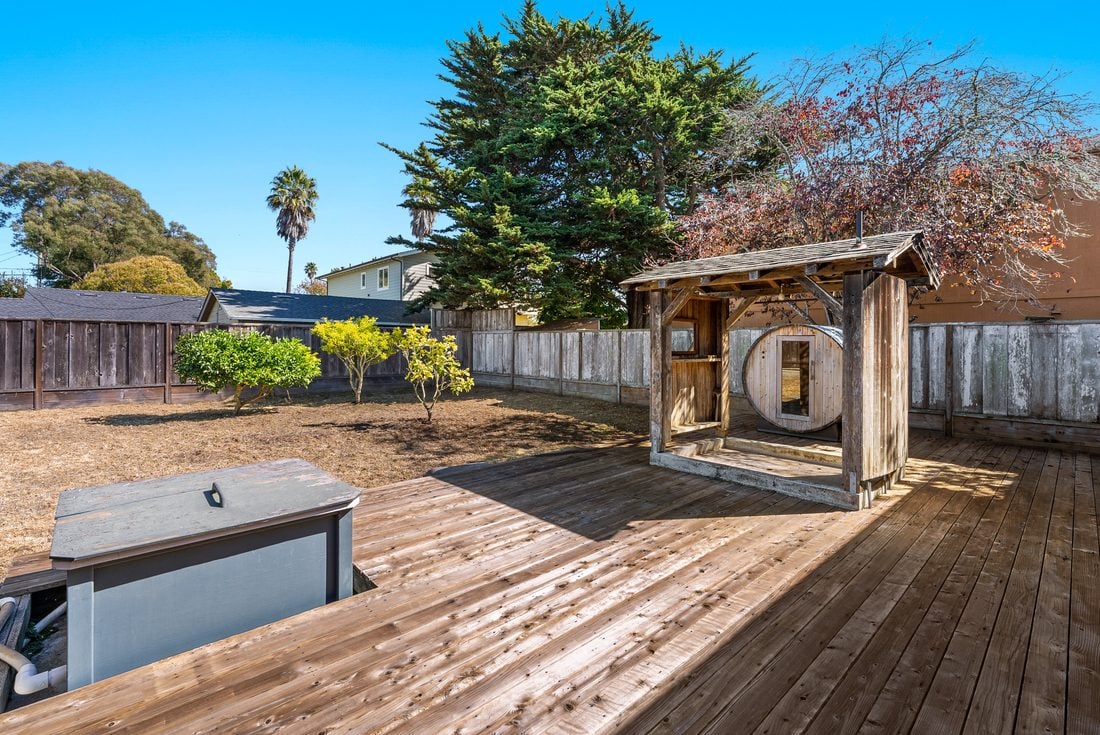 Deck after: clean deck with barrel sauna and hot tub