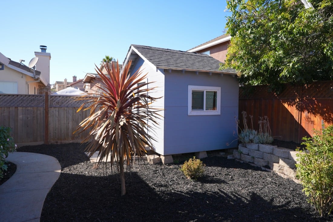 Back yard after: mulched beds, clean patio