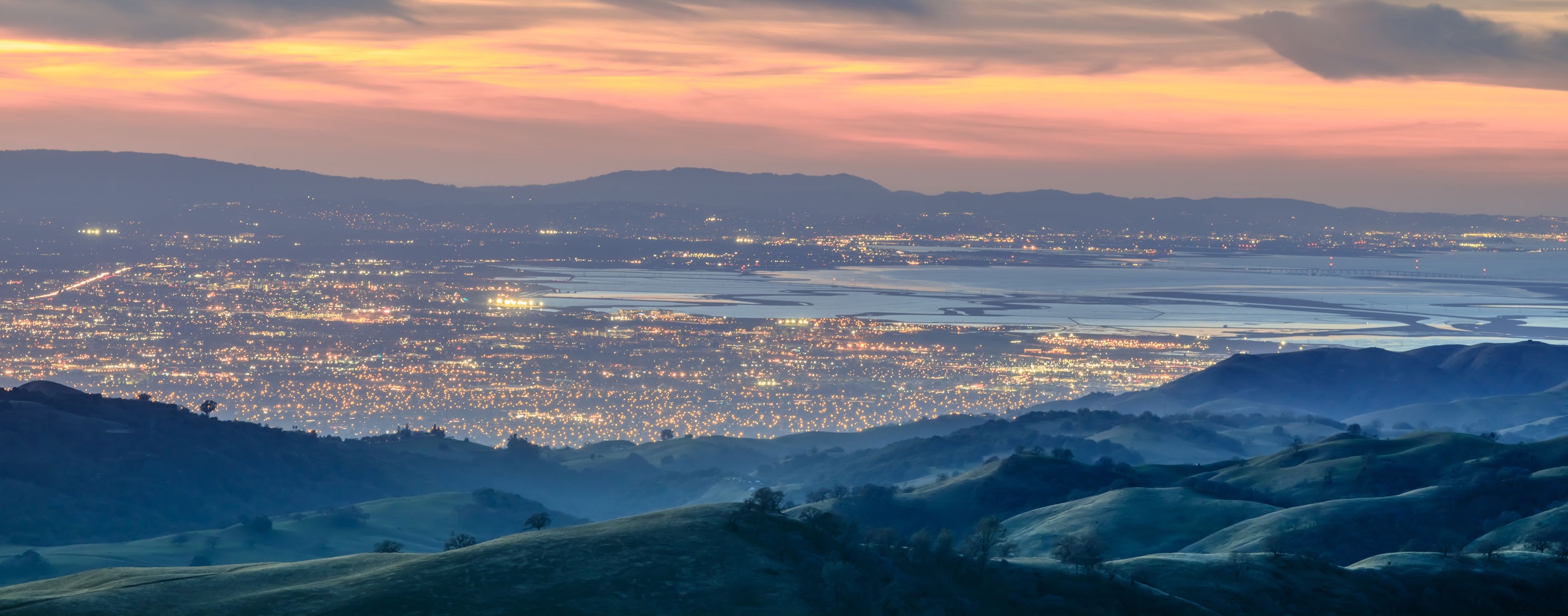 Silicon Valley city lights at dusk seen from the hills