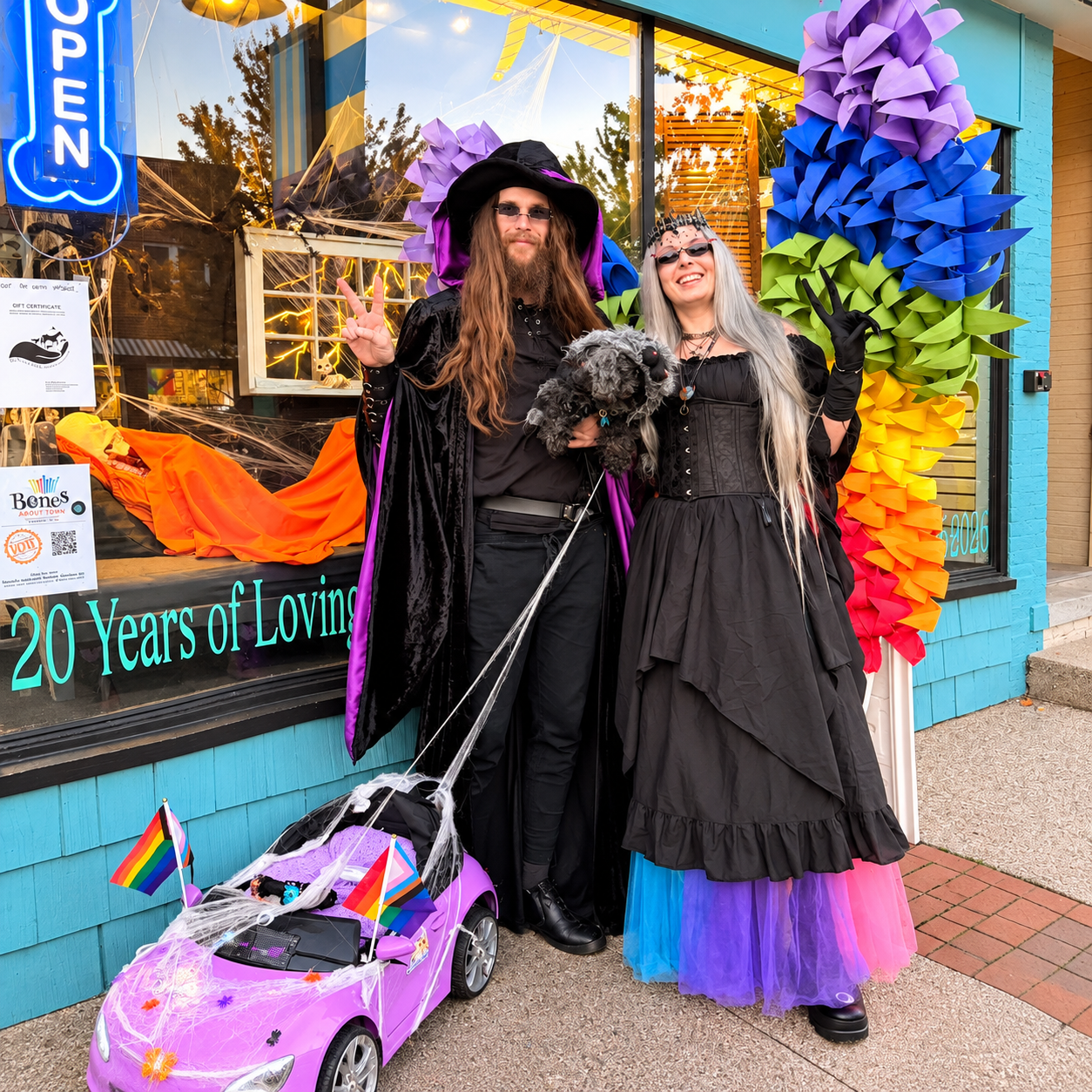Gothic Couple by a Rainbow Flower Shop