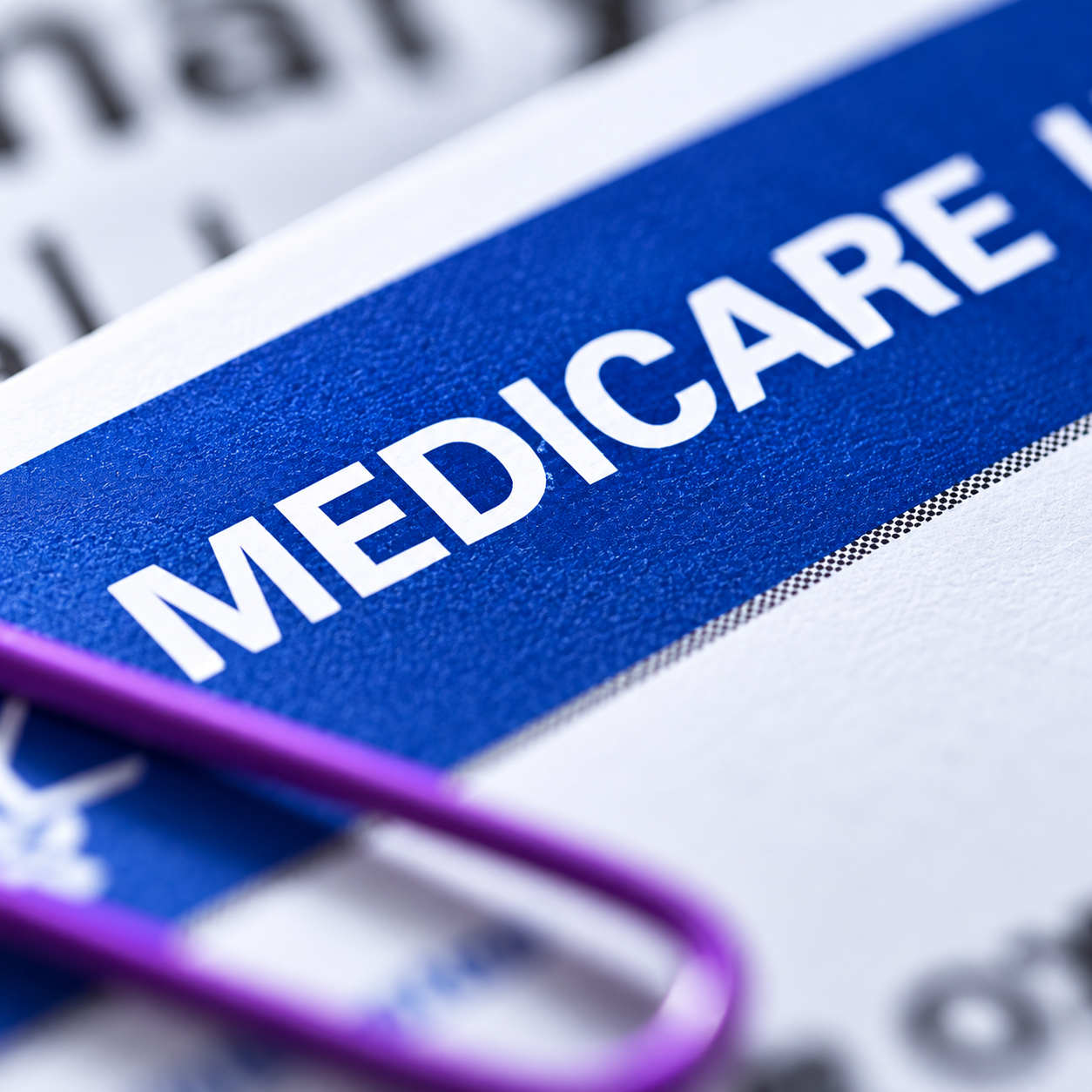 Medicare Document with Purple Paperclip