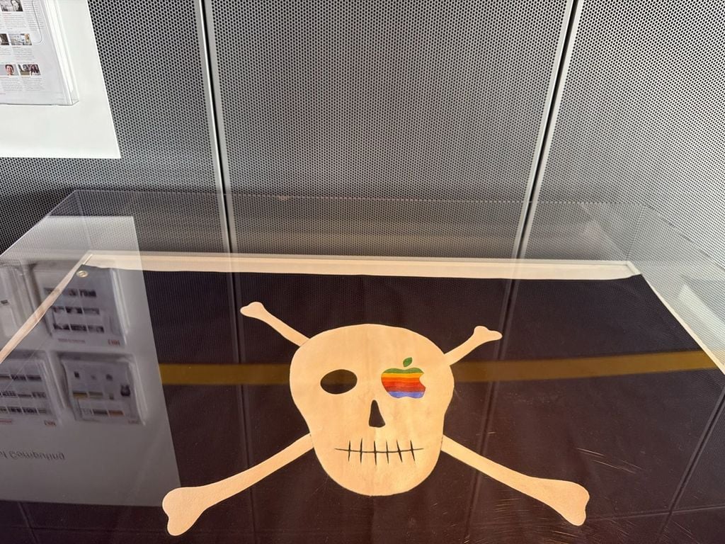 Apple Macintosh team pirate flag with skull and crossbones and rainbow Apple logo eye patch on display at the Computer History Museum