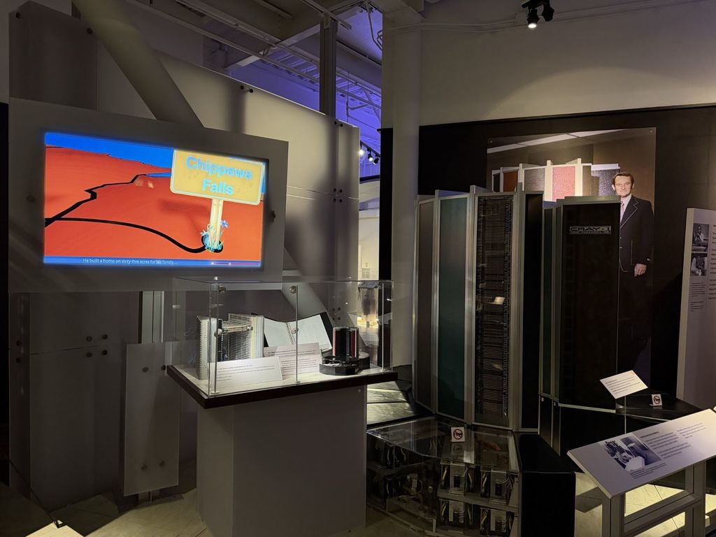 Cray-1 supercomputer with cutout of Seymour Cray and Chippewa Falls video display at the Computer History Museum
