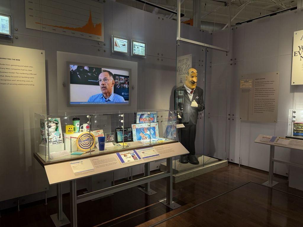 Marketing the Web dot-com exhibit at the Computer History Museum with Pets.com sock puppet, Nasdaq chart and dot-com Monopoly game