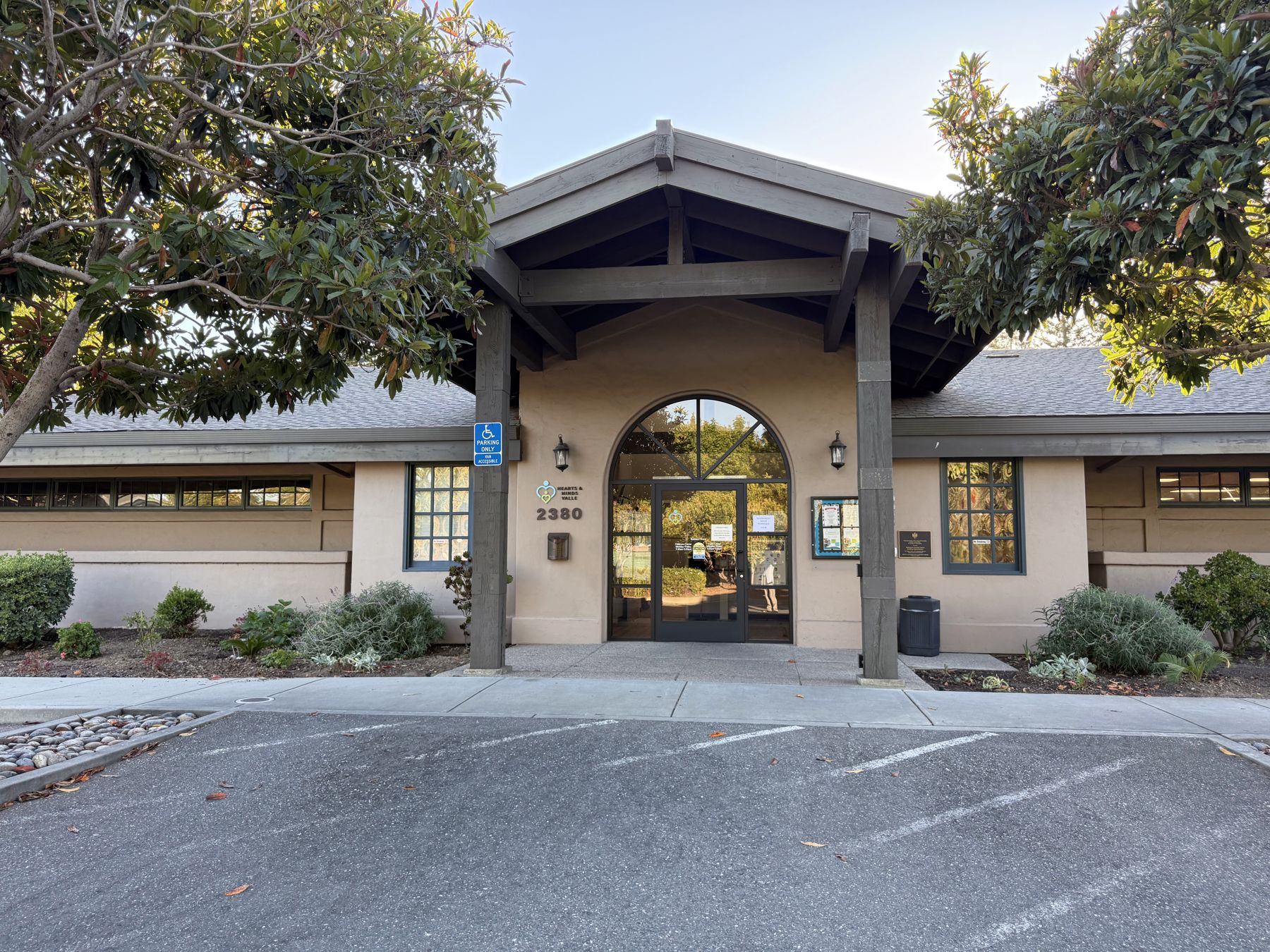 Front entrance of Hearts & Minds Activity Center at 2380 Enborg Lane in San Jose, with its arched glass doorway and covered porch