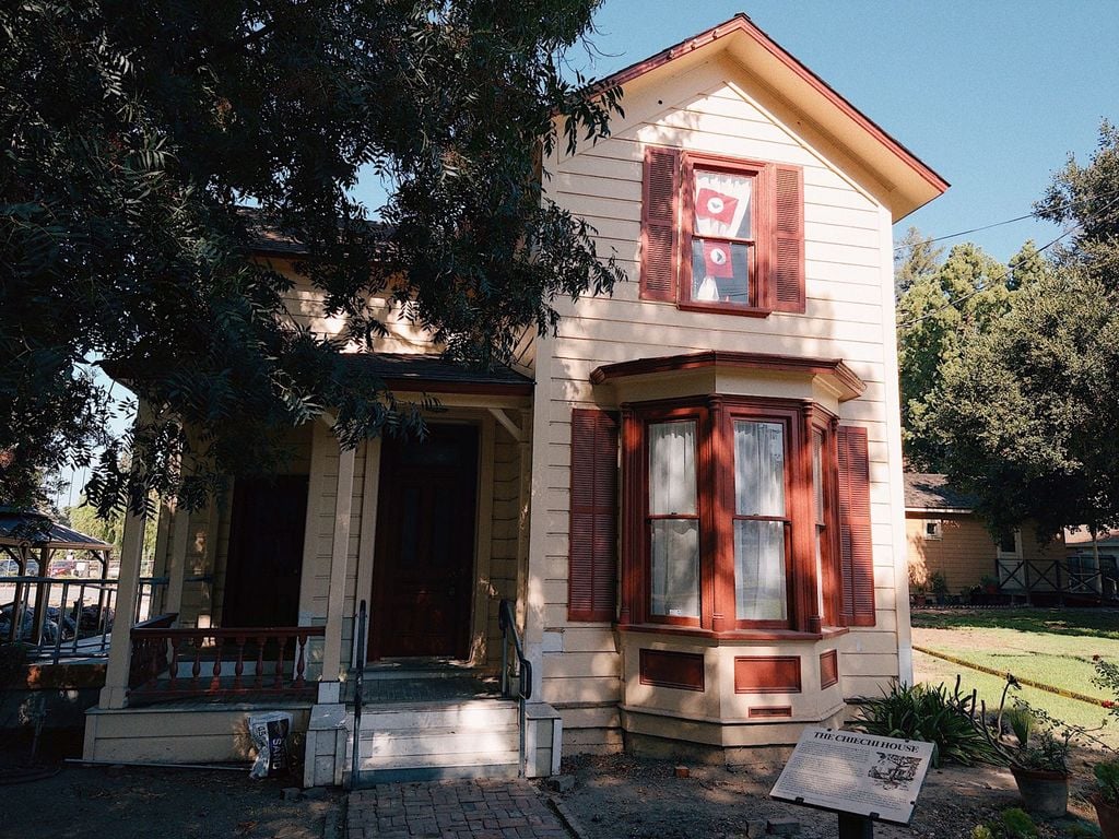 Chiechi House Italianate Victorian with red shutters at History Park San Jose