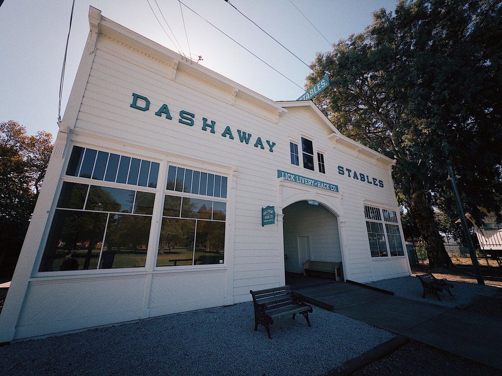 Dashaway Stables replica with Lick Livery and Hack Co. sign at History Park San Jose