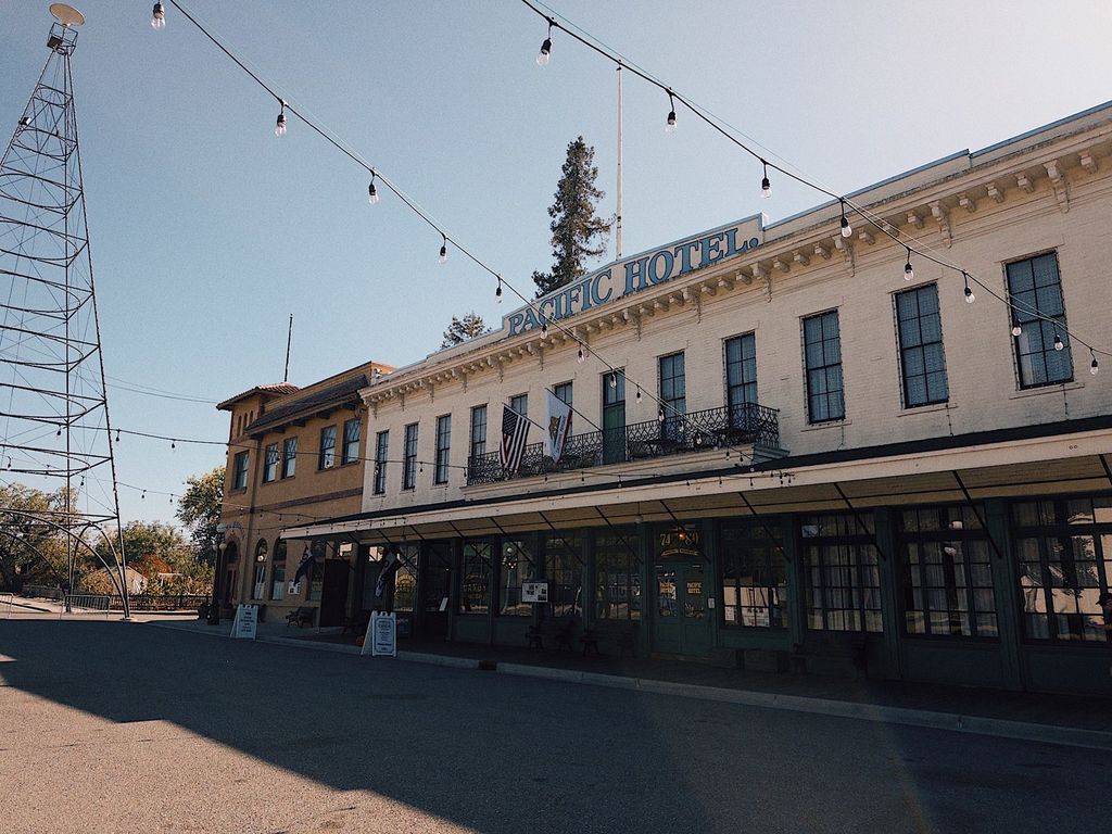 Pacific Hotel replica and Electric Light Tower replica on the main street of History Park San Jose