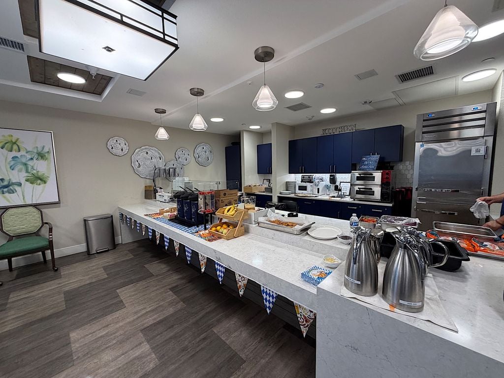 Bistro and dining kitchen with quartz counter and navy cabinets at Ivy Park at San Tomas