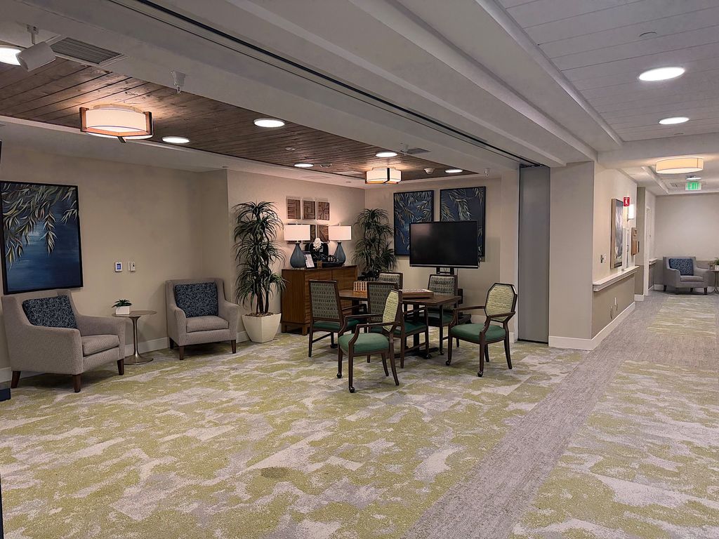 Resident lounge with armchairs, game table and TV at Ivy Park at San Tomas