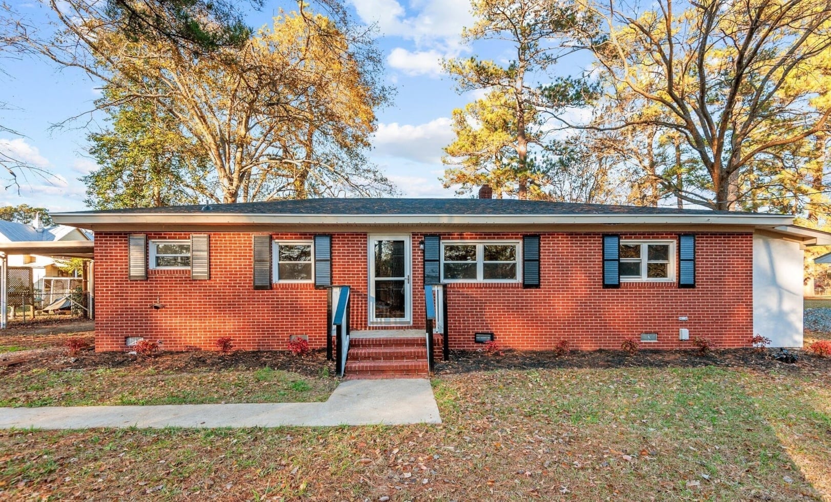 Exterior view of 303 Woodview Drive, a brick ranch home in Goldsboro, North Carolina