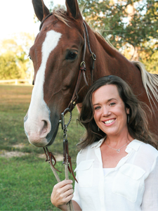 Devon Broughton with a horse at Triangle Equine Assisted Learning.