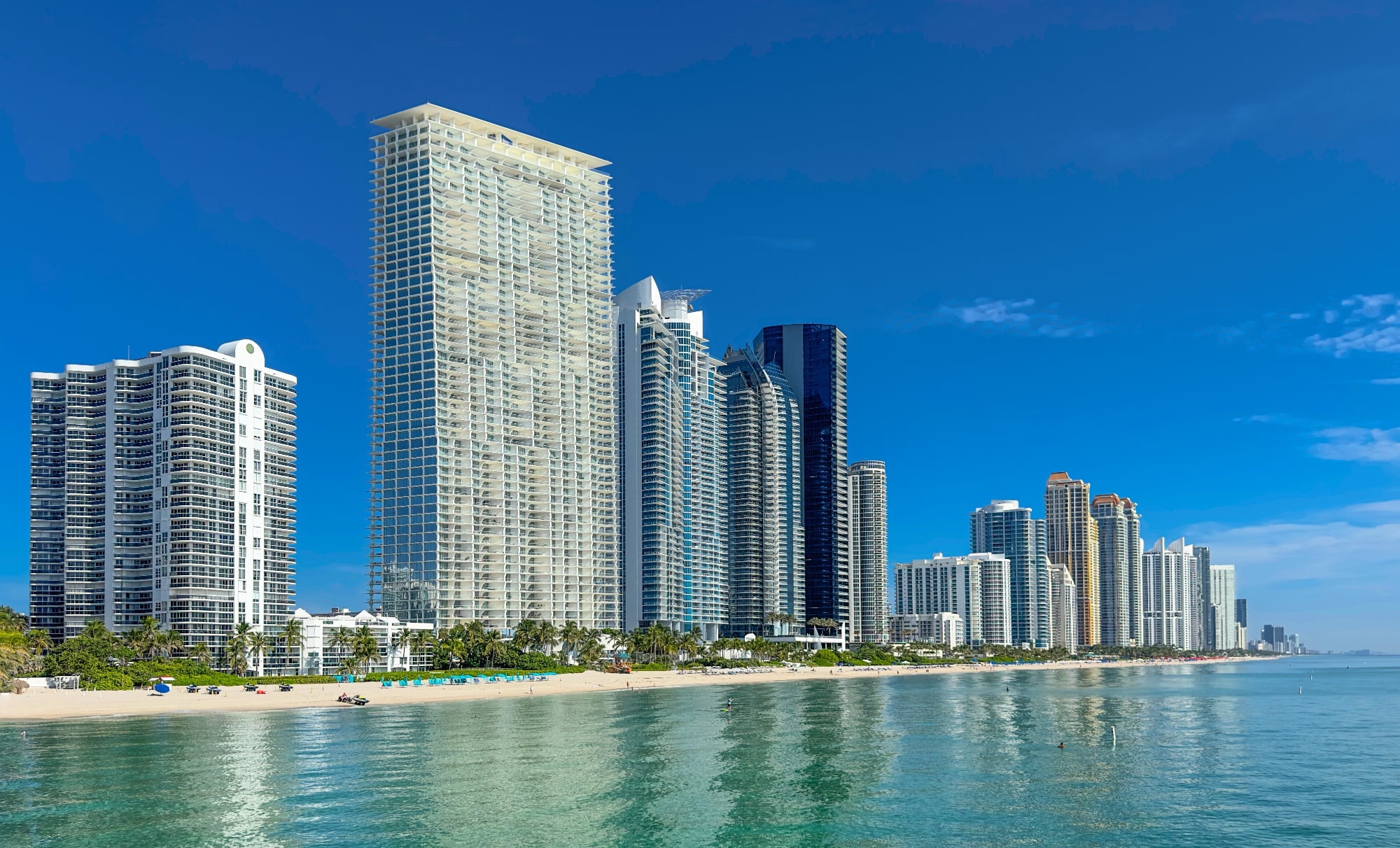 Miami Sunny Isles Beach Florida. Panorama of Miami Beach FL. Atlantic Ocean beach. Beautiful seascape. Cityscape with skyscrapers, skyline. Summer vacation in Florida. Hotels and Resorts on Island
