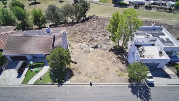 30789 Early Round Drive, Canyon Lake CA - aerial view of the lot looking across the golf course to the hills