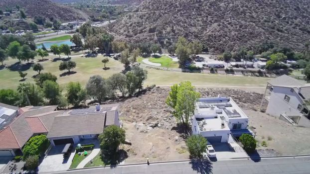 30789 Early Round Drive, Canyon Lake CA - aerial view across the lot toward the golf course