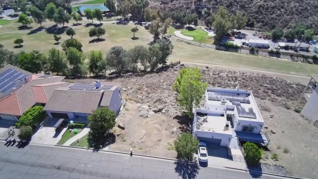 30789 Early Round Drive, Canyon Lake CA - aerial view of the lot with the golf course behind it
