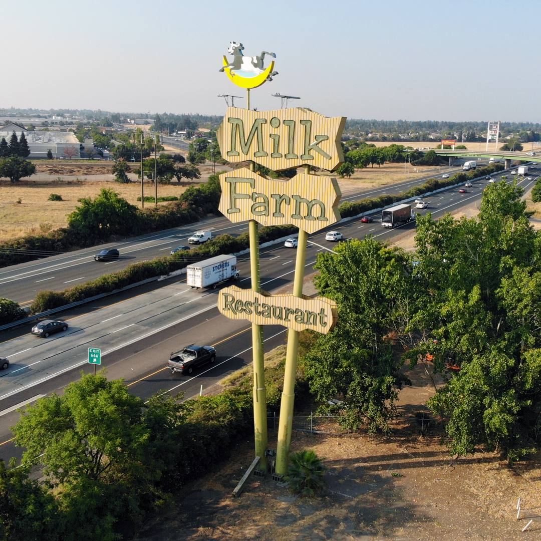 Drone view of Interstate 80 and the Milk Farm sign at the west edge of Dixon, California, 2018