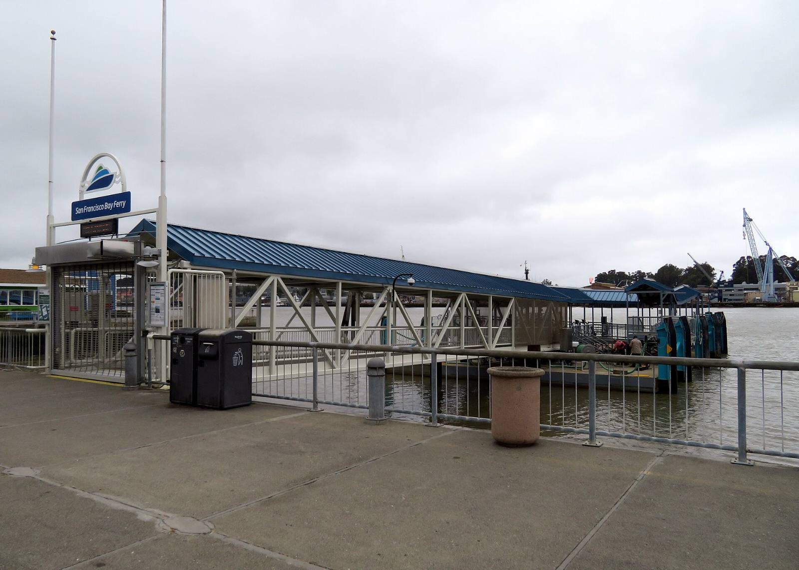 The covered gangway and boarding dock at the Vallejo Ferry Terminal under the San Francisco Bay Ferry sign, Vallejo, California, May 2019
