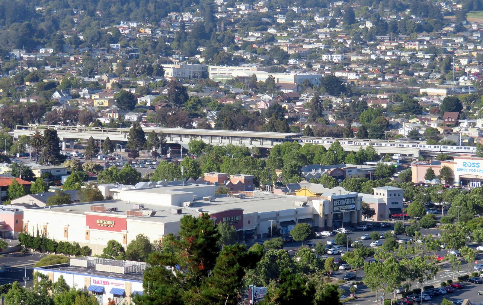 El Cerrito Plaza BART station, its parking lots and the Plaza shopping center seen from Albany Hill, July 2018