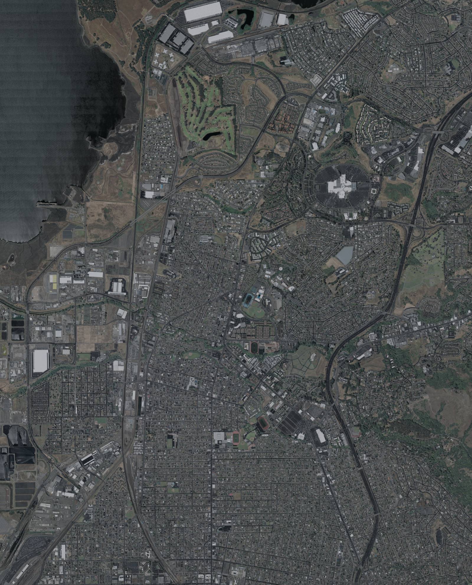 USDA aerial image from May 2022 of San Pablo and north Richmond, with tree-lined creek corridors crossing the city toward San Pablo Bay