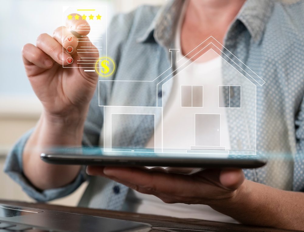 Person,Using,Digital,Tablet,To,Assess,Property,Value,And,Real