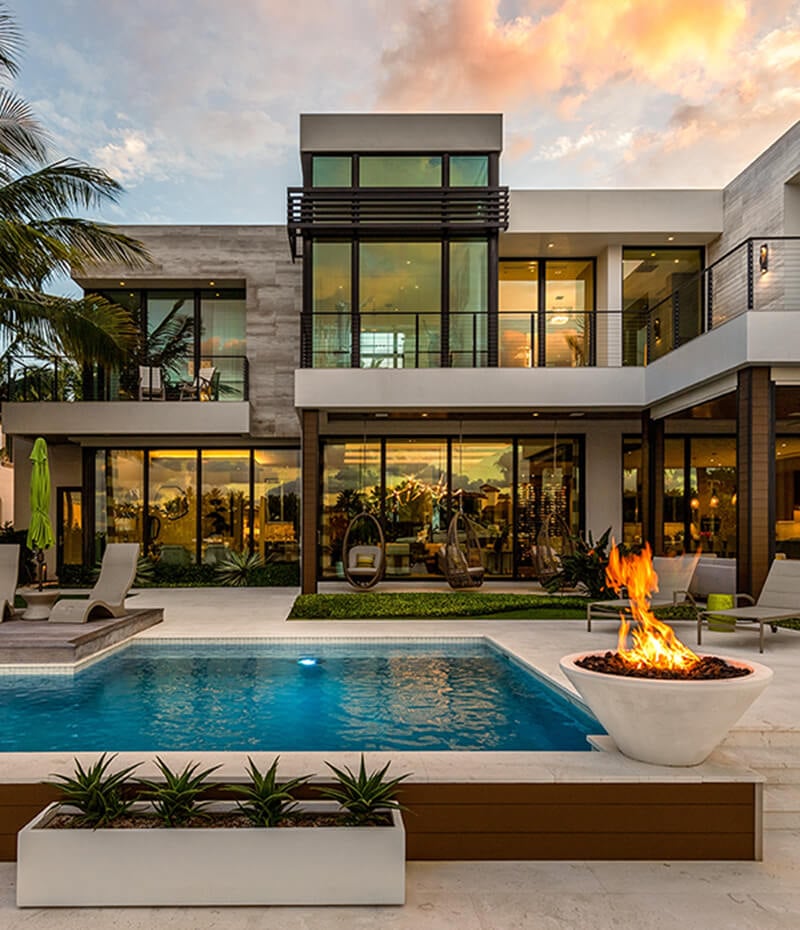 Florida-Modern-building-with-swimming-pool,-trees,-chairsb