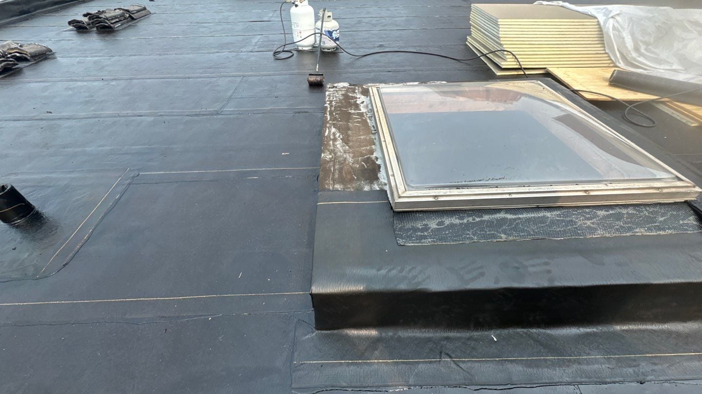 Flashing and waterproofing detail on the new flat roof