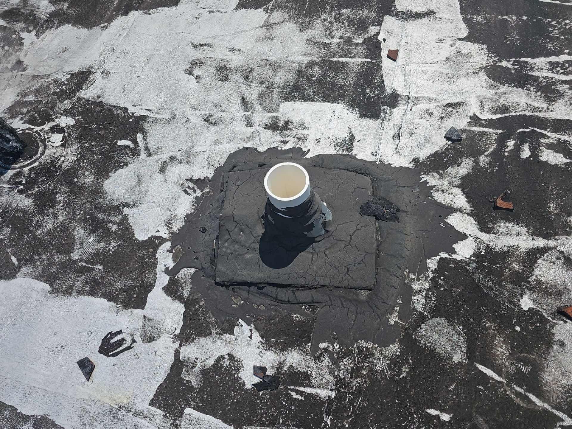Close view of wear on the existing flat roof