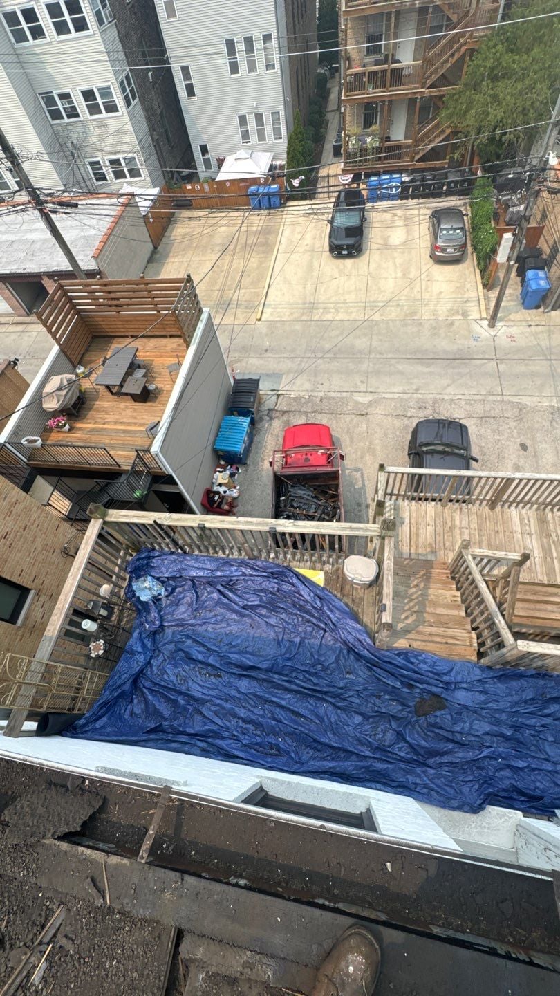 Roofing materials staged for the multifamily roof replacement