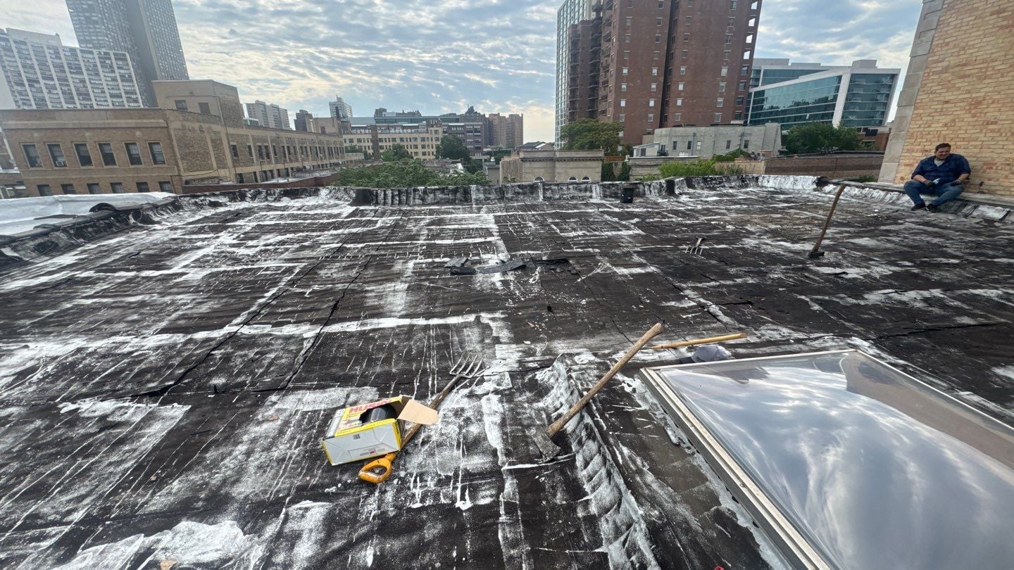 Roof replacement project setup and debris removal area