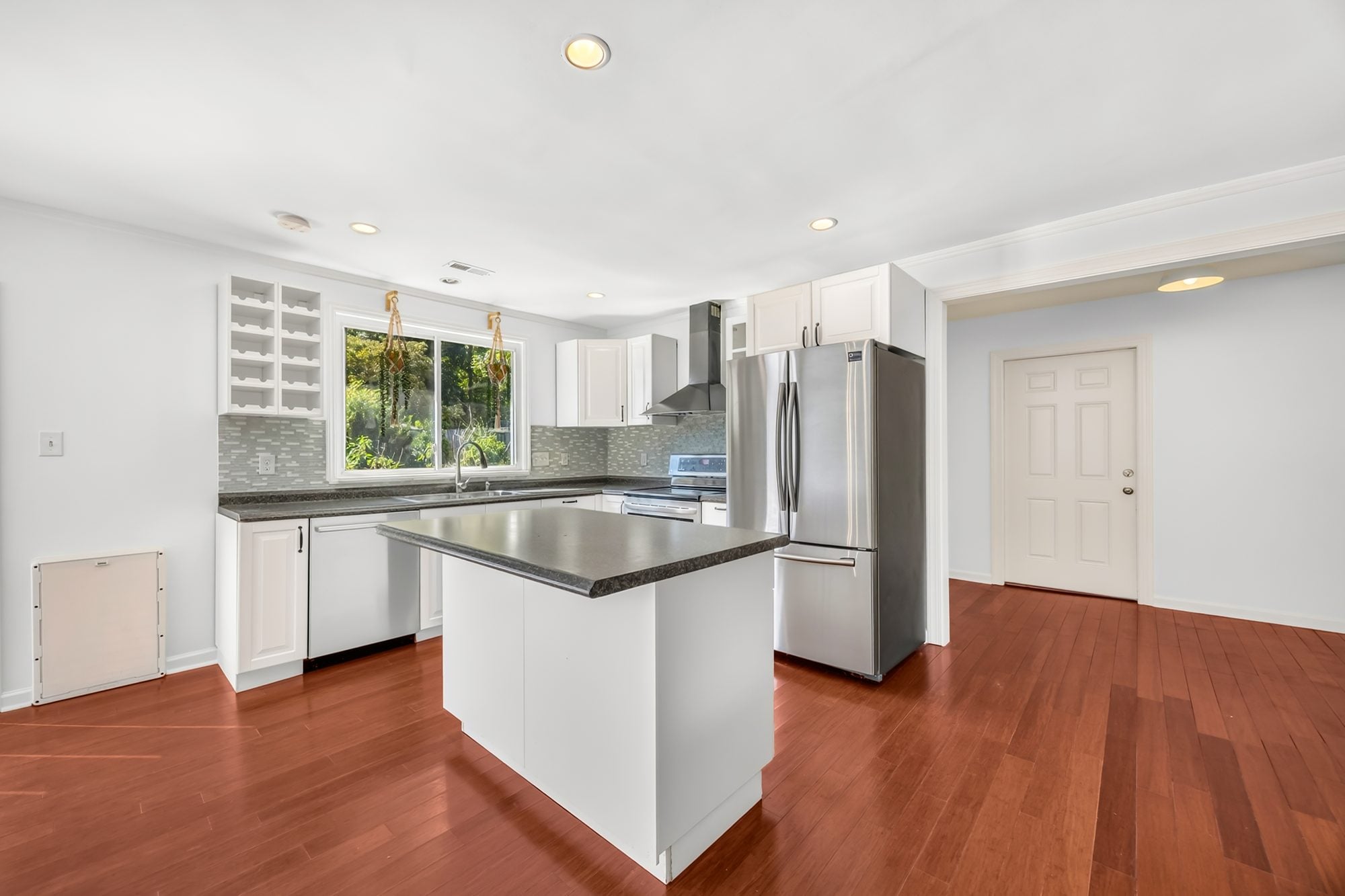 Kitchen with island and stainless appliances at 4900 Cricklewood Lane