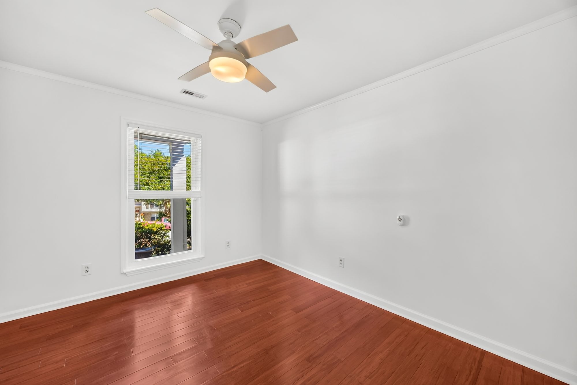 Bedroom with wood floors at 4900 Cricklewood Lane