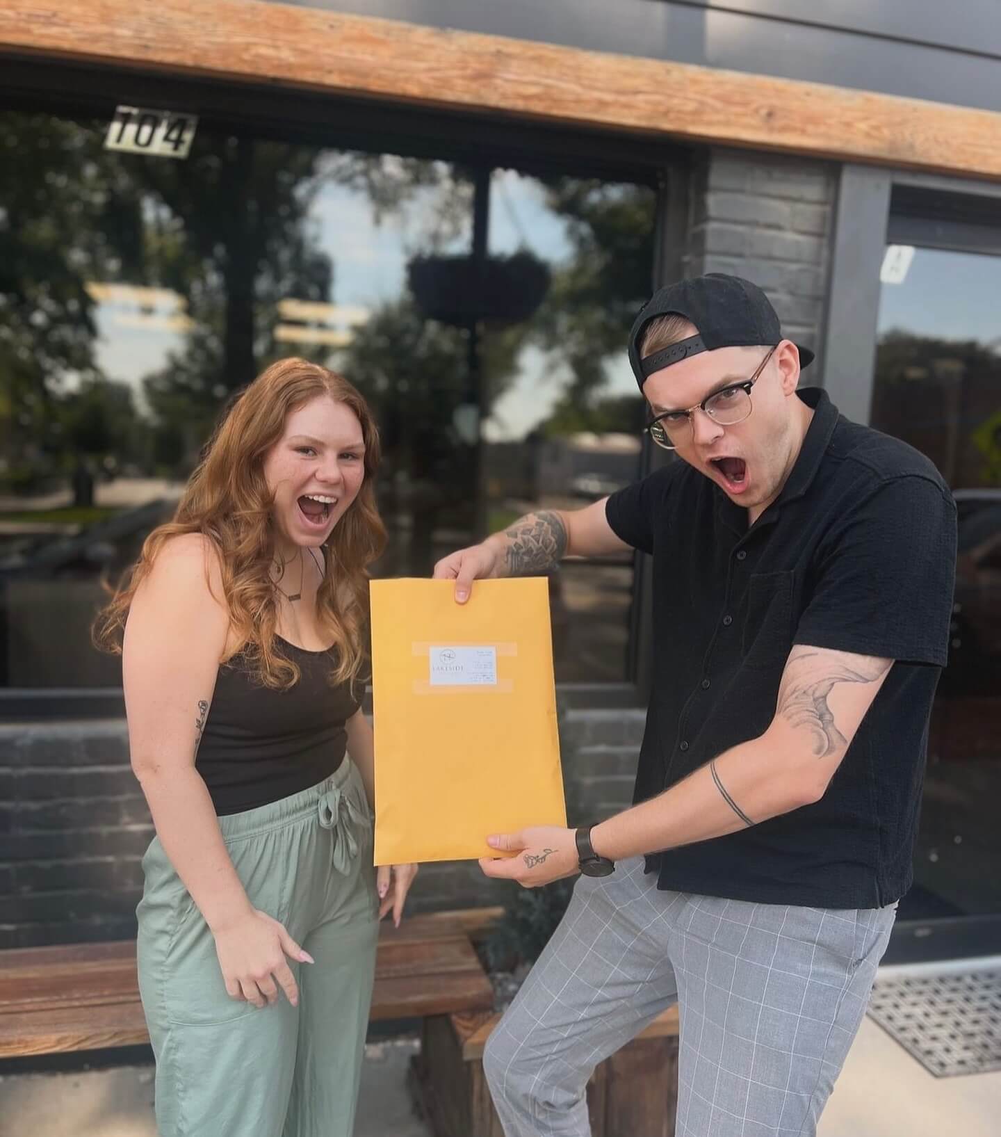 excited people holding envelope