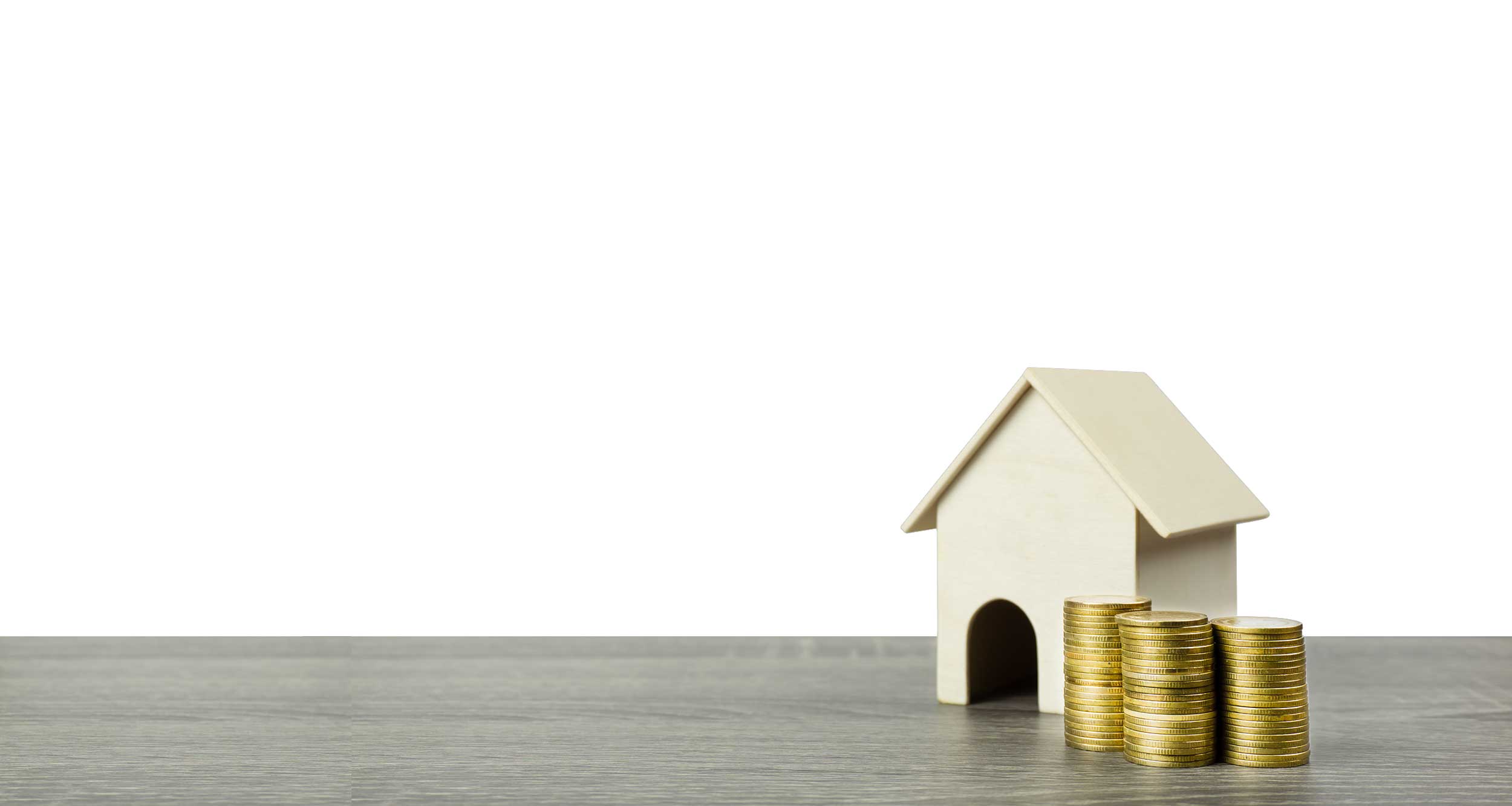 Real estate investment concept - house model with coins representing rental income