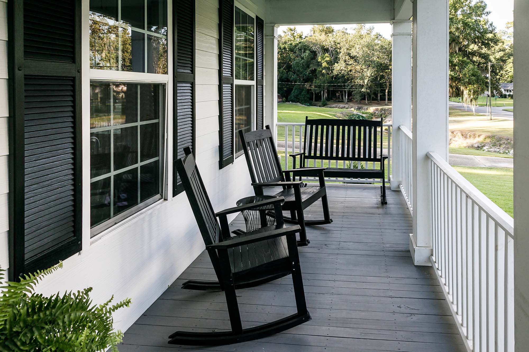 Retired couple enjoying morning coffee on the porch of a Temple Texas home