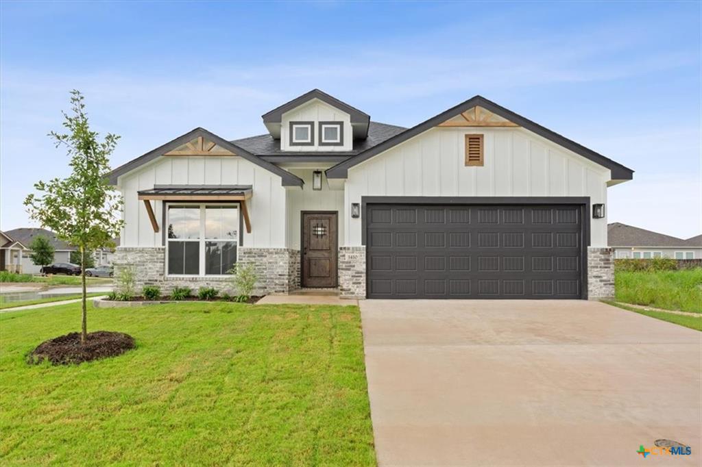 Prairie Ridge new construction home in Temple TX — modern ranch elevation with stone and brick masonry
