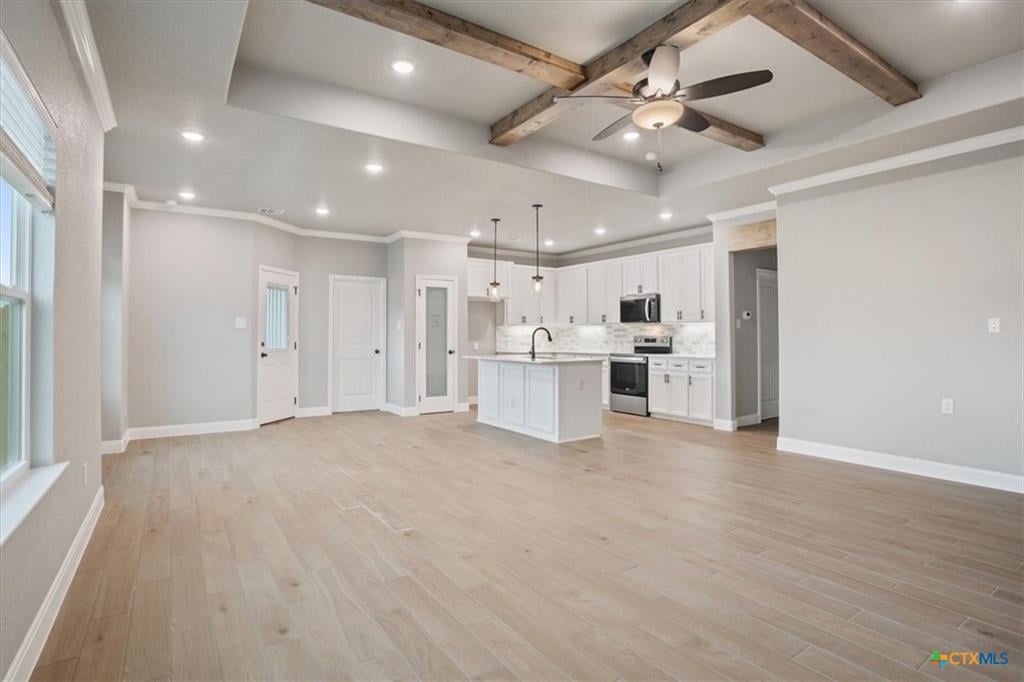 Prairie Ridge interior with open beamed ceilings — modern new construction in Temple TX