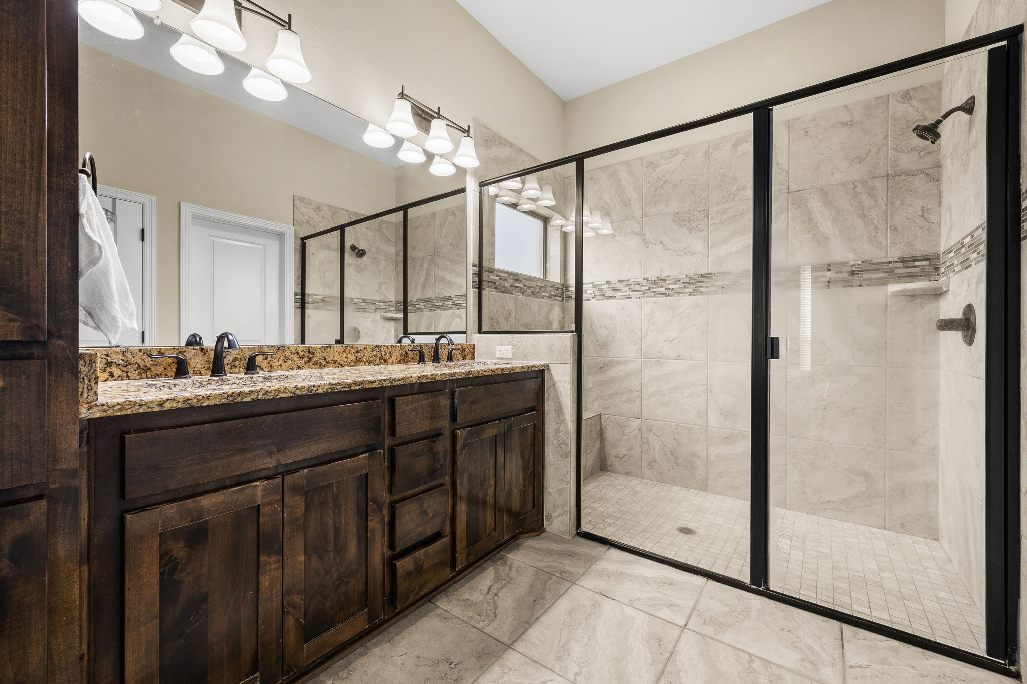 Primary bathroom walk-in shower and vanity