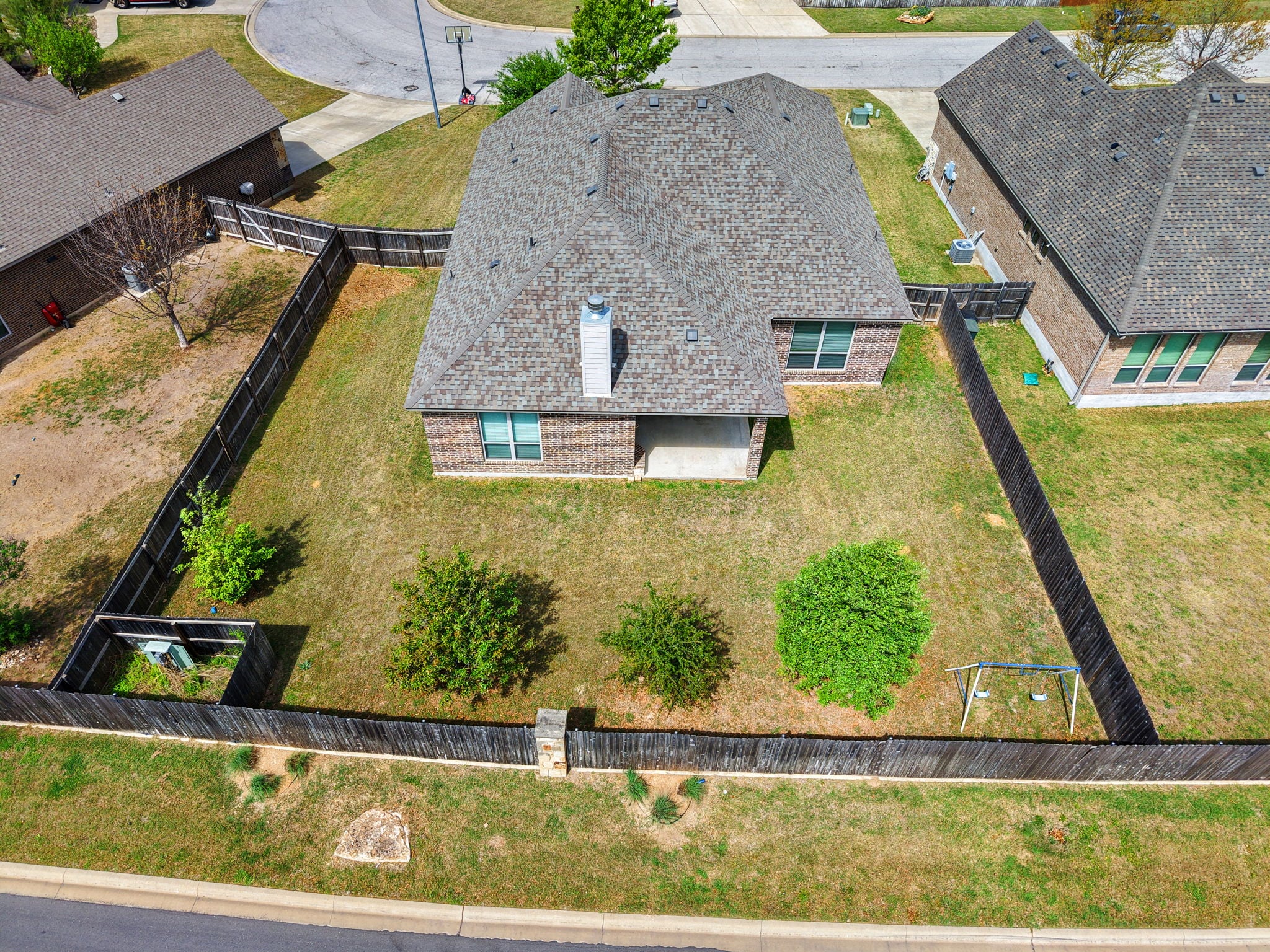 Aerial view of backyard, patio, and lot